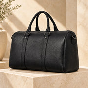 Side view of the black ALTAIR leather travel bag